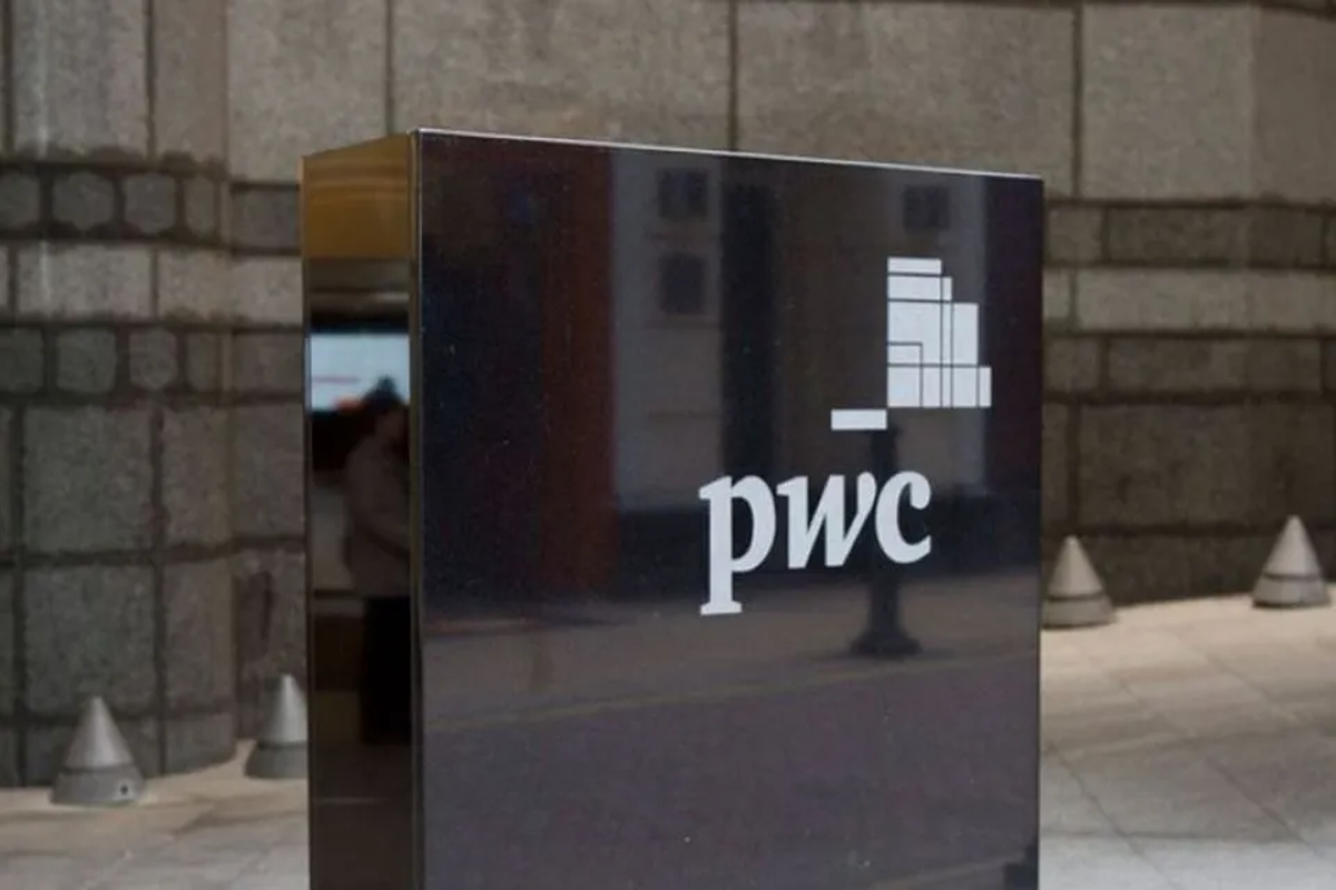 Teneo and PwC New Zealand executives shaking hands to finalize business restructuring unit acquisition deal