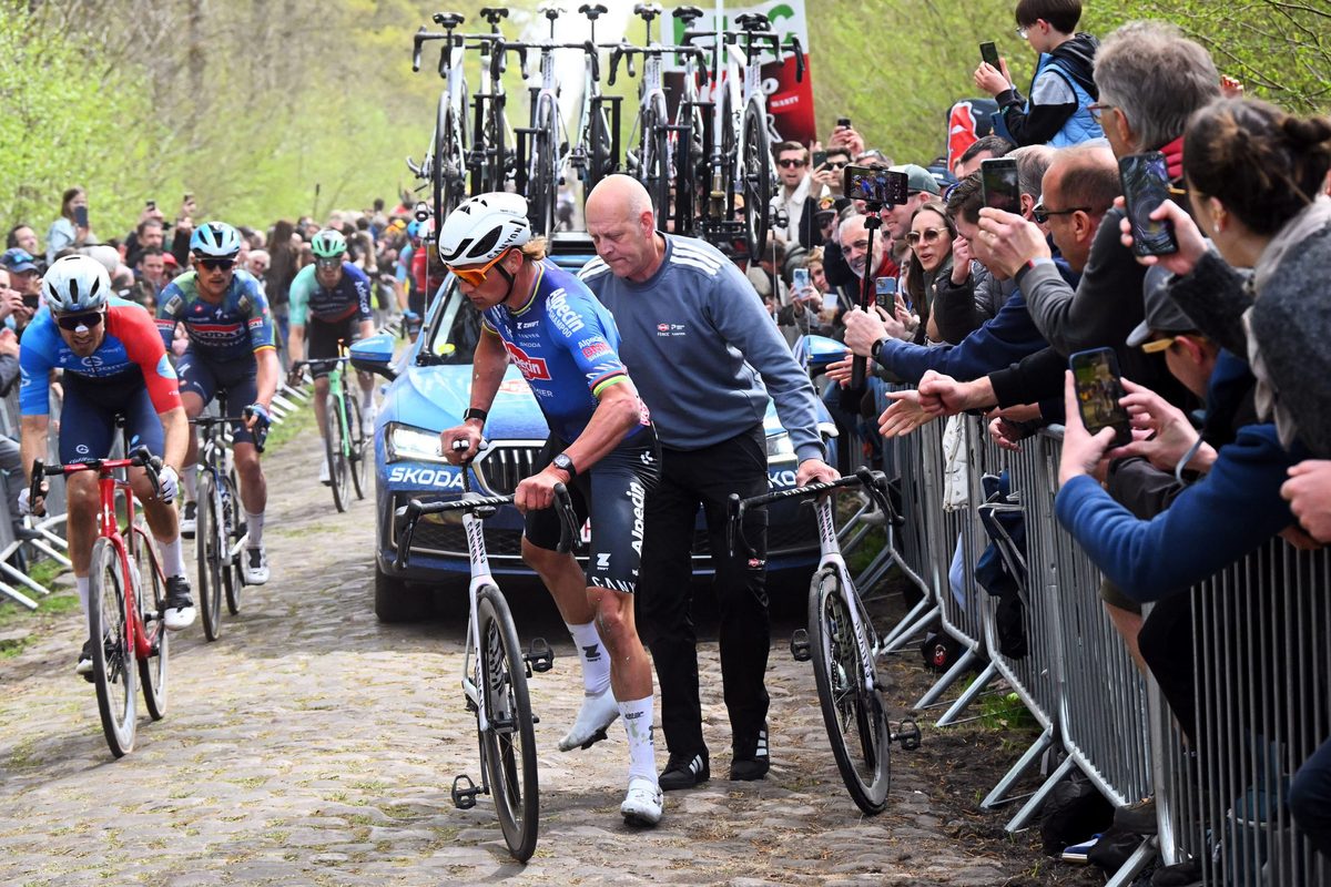 ROUBAIX, FRANCE - APRIL 12: Mathieu van der Poel of Netherlands and Team Alpecin-Premier Tech changes his bike passing through the Trouee d