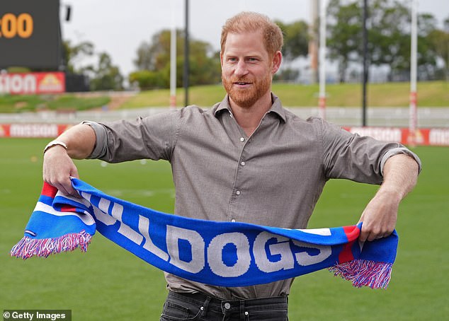 MELBOURNE, AUSTRALIA - APRIL 15: Prince Harry, Duke of Sussex is presented with a Western Bulldogs scarf during a visit to Movember at the Western Bulldogs HQ at Mission Whitten Oval on April 15, 2026 in Footscray, Melbourne, Australia. Meghan and Prince Harry, Duke of Sussex are on a four-day visit to Australia, with engagements across Melbourne, Canberra and Sydney. (Photo by Jonathan Brady-Pool/Getty Images)