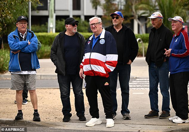 Western Bulldogs supporters wait to enter the ground for a training session as Prince Harry the Duke of Sussex visits with the Movember Foundation at the Western Bulldogs headquarters, Whitten Oval in Melbourne, Wednesday, April 15, 2026. (AAP Image/Joel Carrett) NO ARCHIVING