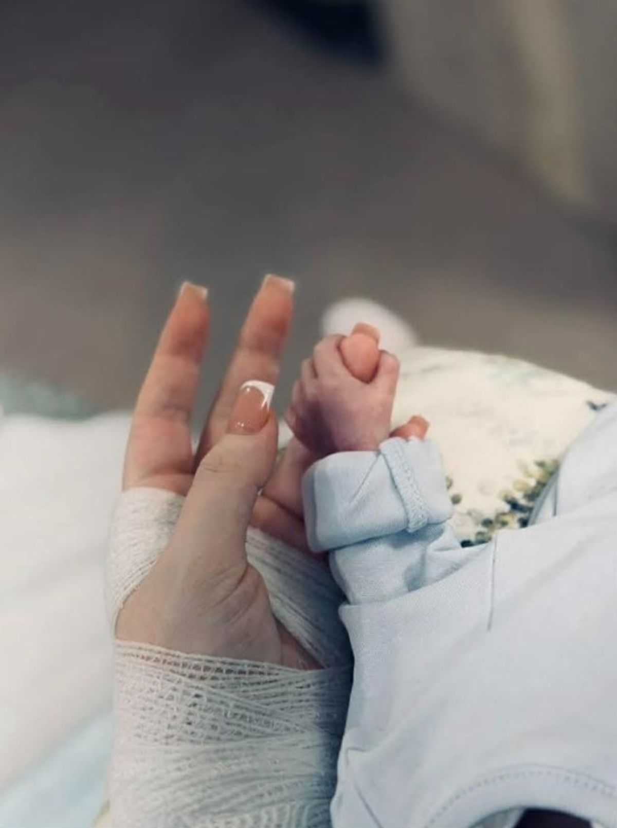 Megan holding Luca's hand