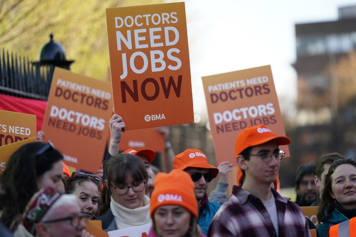 Resident doctors gather outside the Royal Victoria Infirmary in Newcastle