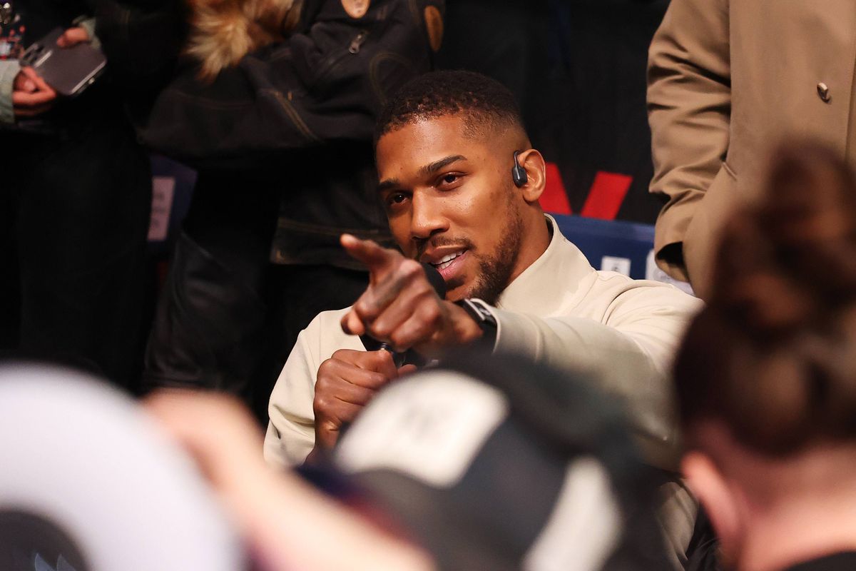 LONDON, ENGLAND - APRIL 11: Anthony Joshua gestures towards Tyson Fury (not pictured) after the Heavyweight fight between Tyson Fury and Arslanbek Makhmudov at Tottenham Hotspur Stadium on April 11, 2026 in London, England. (Photo by Richard Pelham/Getty Images for Netflix)