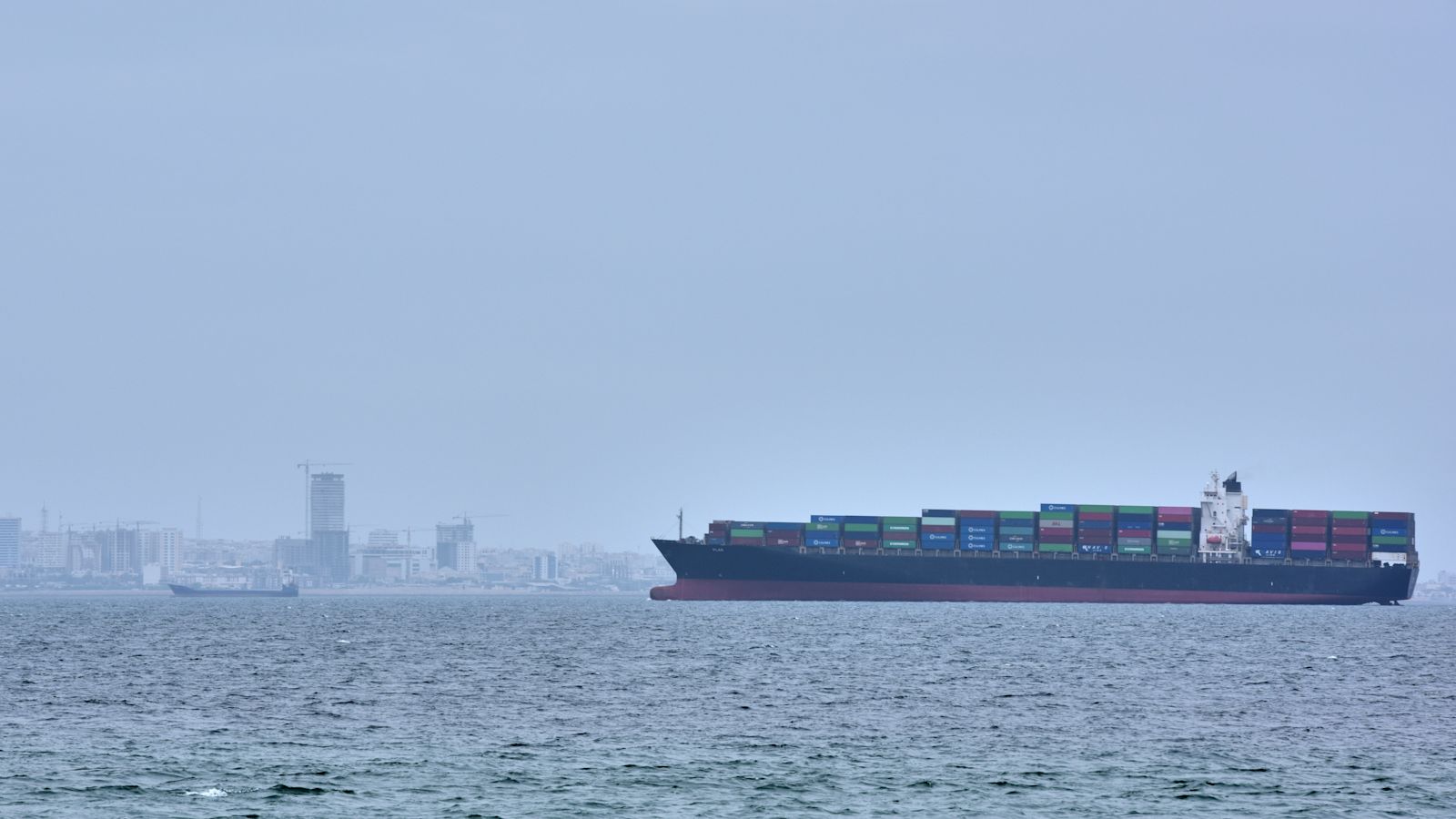 Tanker and container ship attacked, UK military says, after Iran closes Strait of Hormuz again