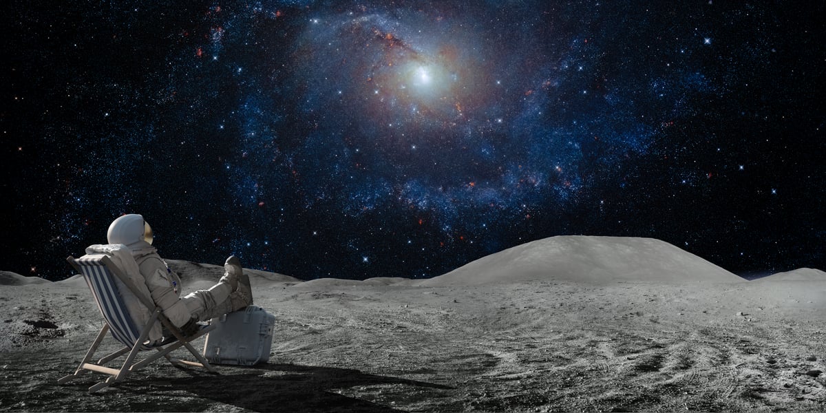 An astronaut sits on the moon.