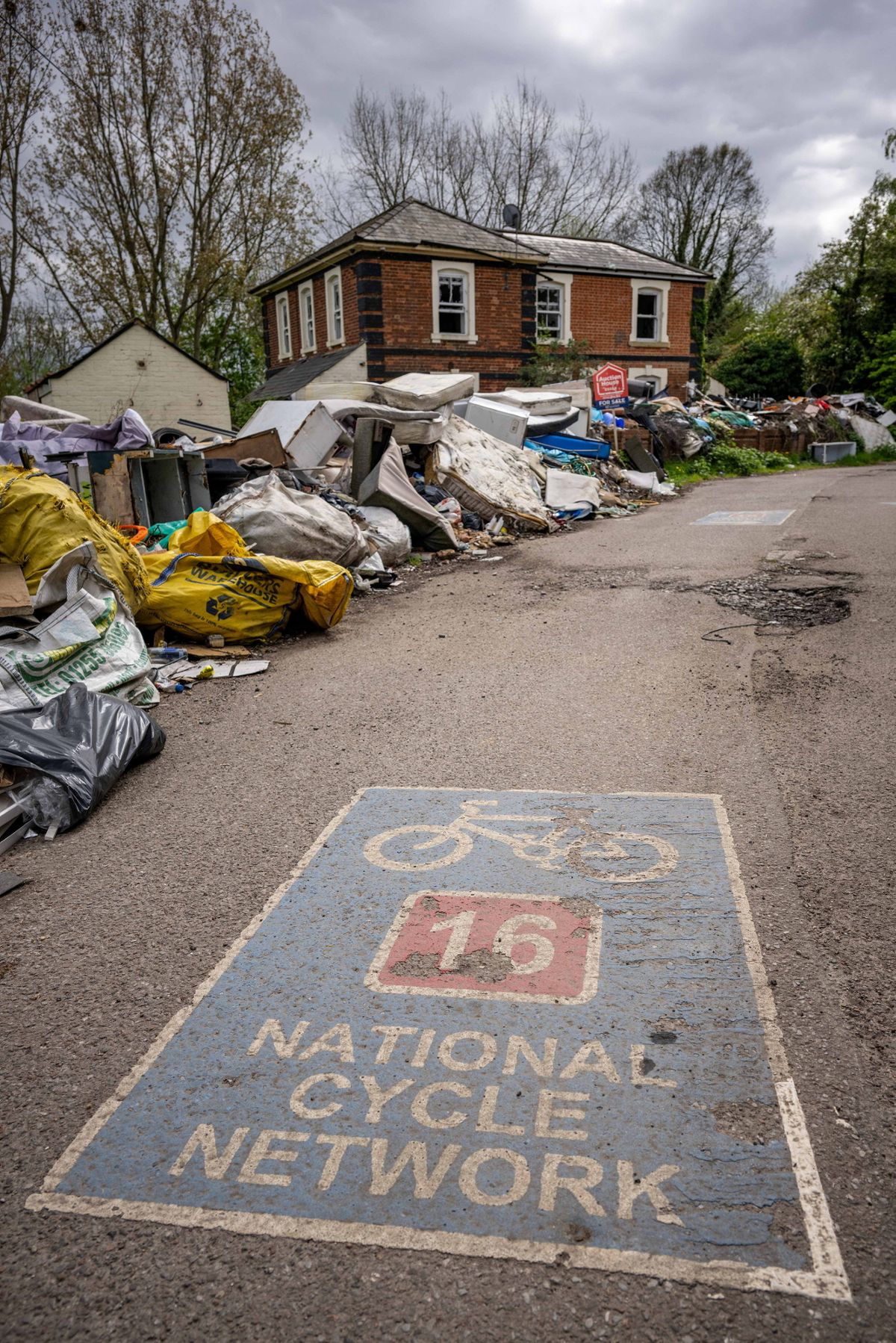 There are piles of old furniture, fridges and mattresses stretching for more than 80 metres