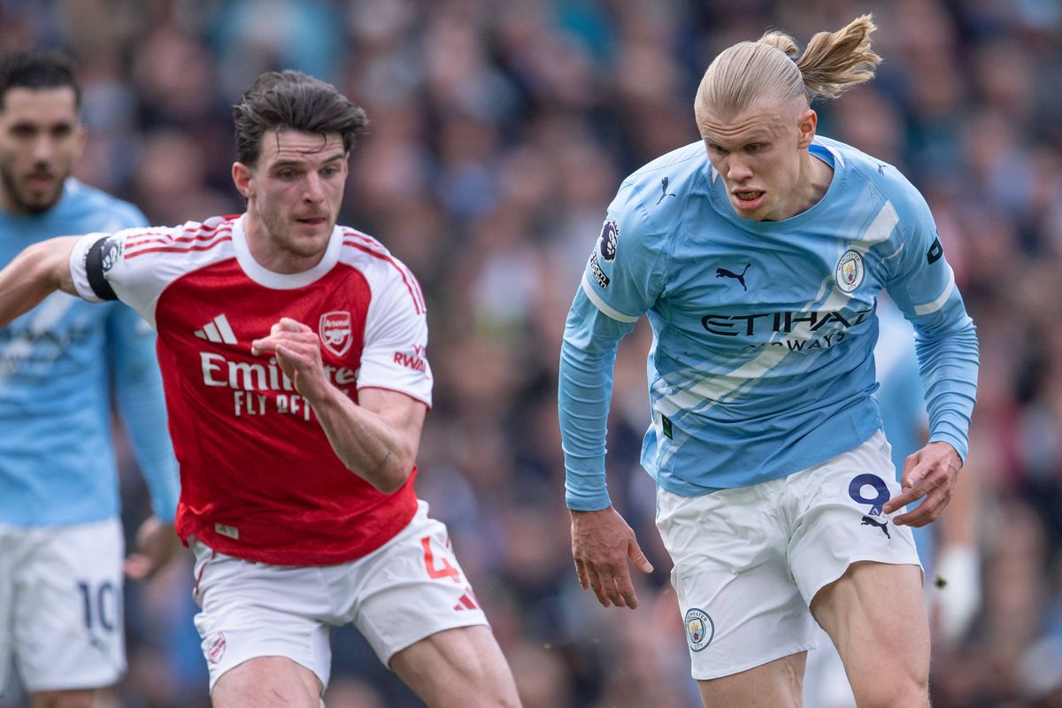 Erling Haaland of Manchester City and Declan Rice of Arsenal in action