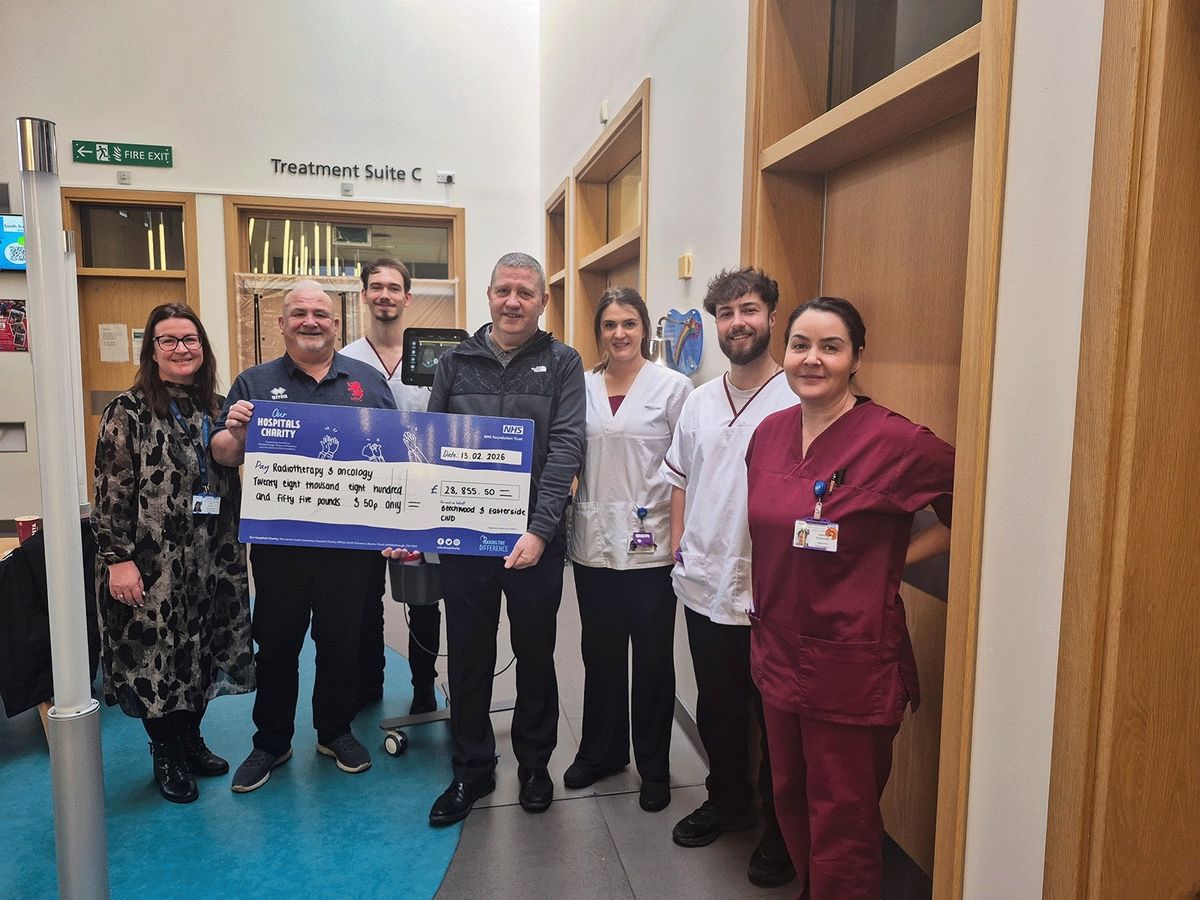 Mick and Harry make their donation to the radiotherapy team at The James Cook University Hospital