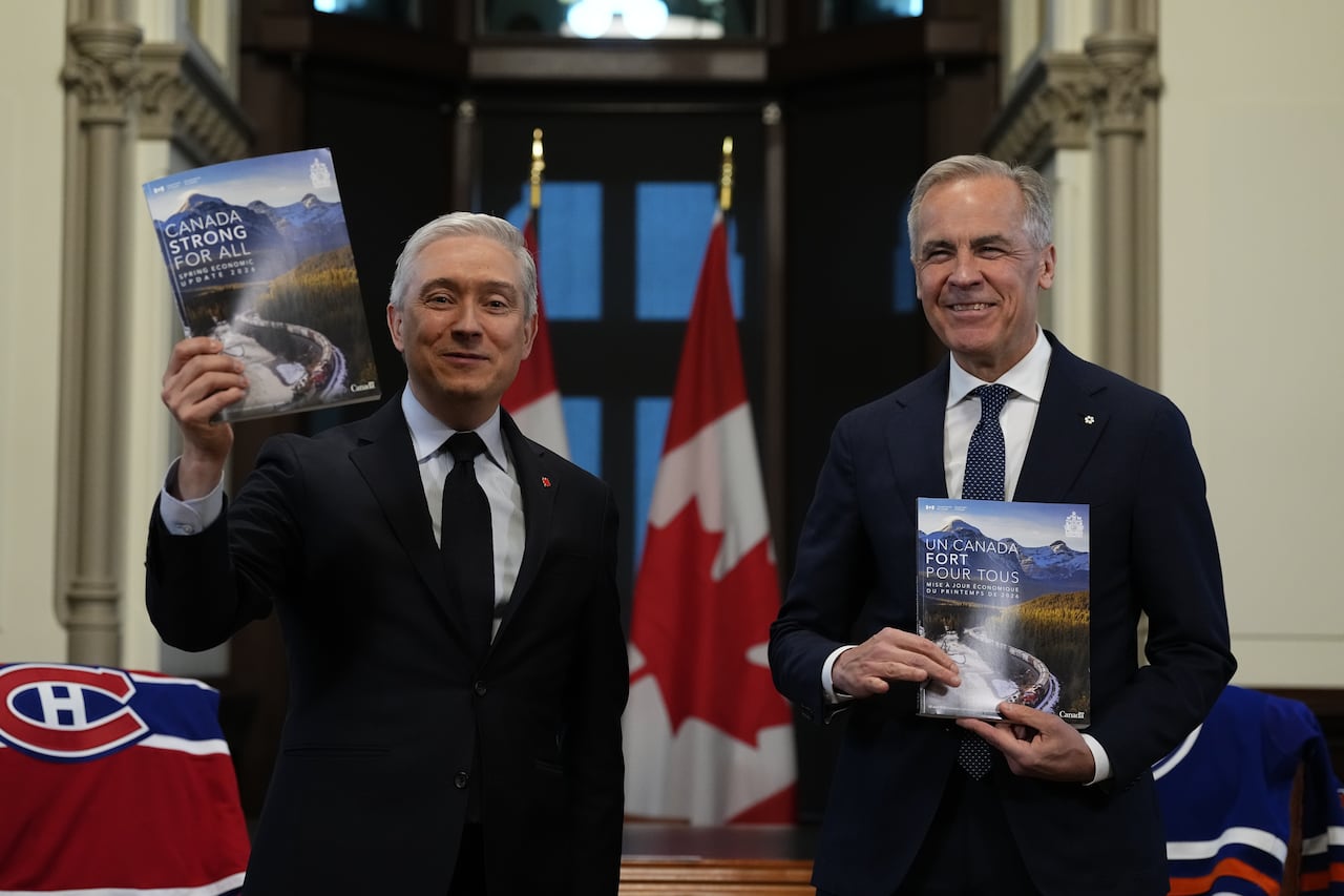 Prime Minister Mark Carney, right, and Minister of Finance and National Revenue Francois-Philippe Champagne participate in a photo op before the tabling of the spring economic update, on Parliament Hill in Ottawa on Tuesday, April 28, 2026.