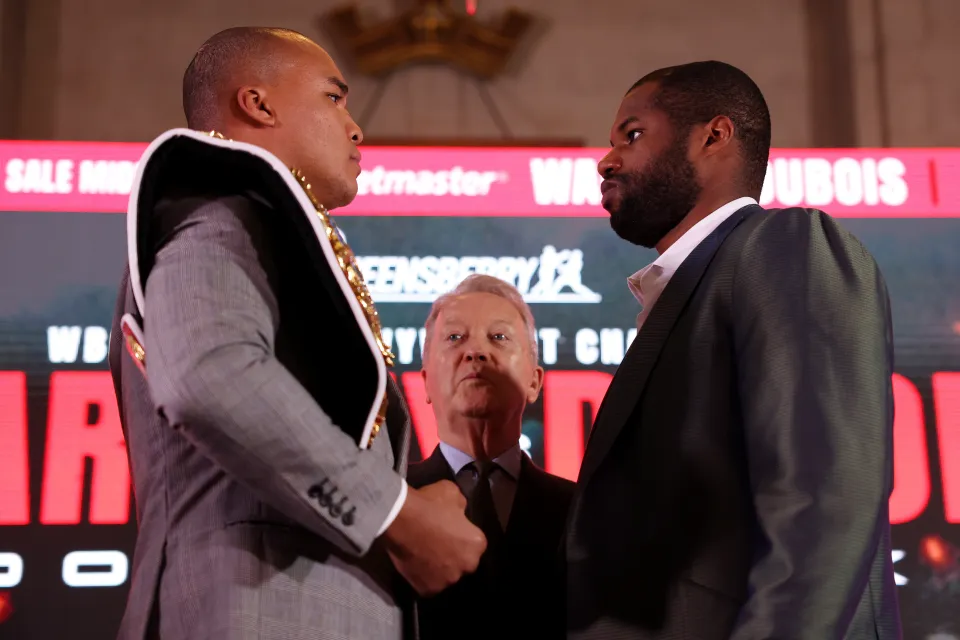 Frank Warren looks on as Fabio Wardley and Daniel Dubois face off as they pose for a photograph during the Fabio Wardley v Daniel Dubois Press Conference at The Dutch Hall on February 25, 2026 in London, England