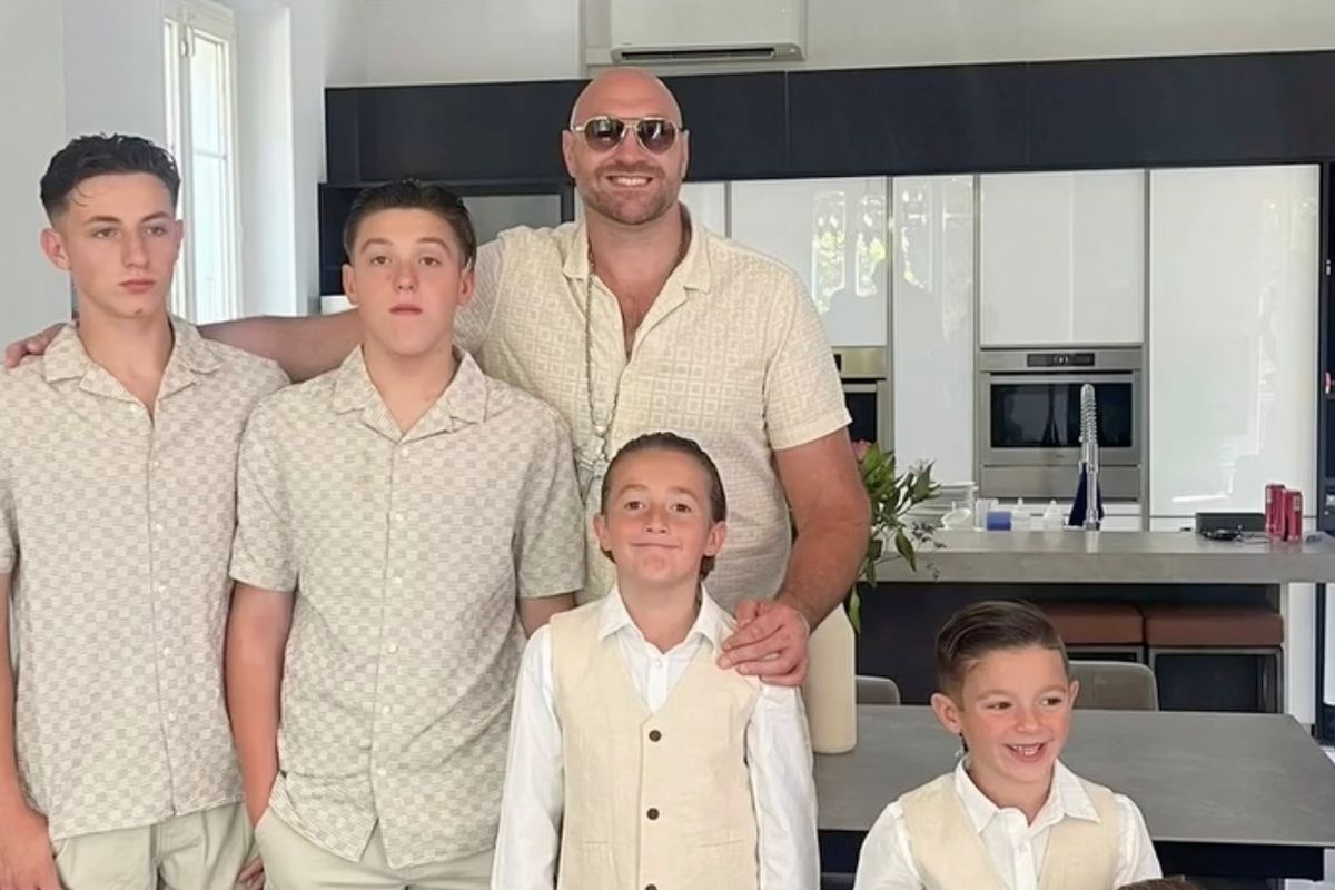 Tyson posing with his sons 