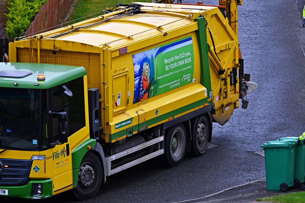Many people have issues having too much rubbish for their bin (stock)
