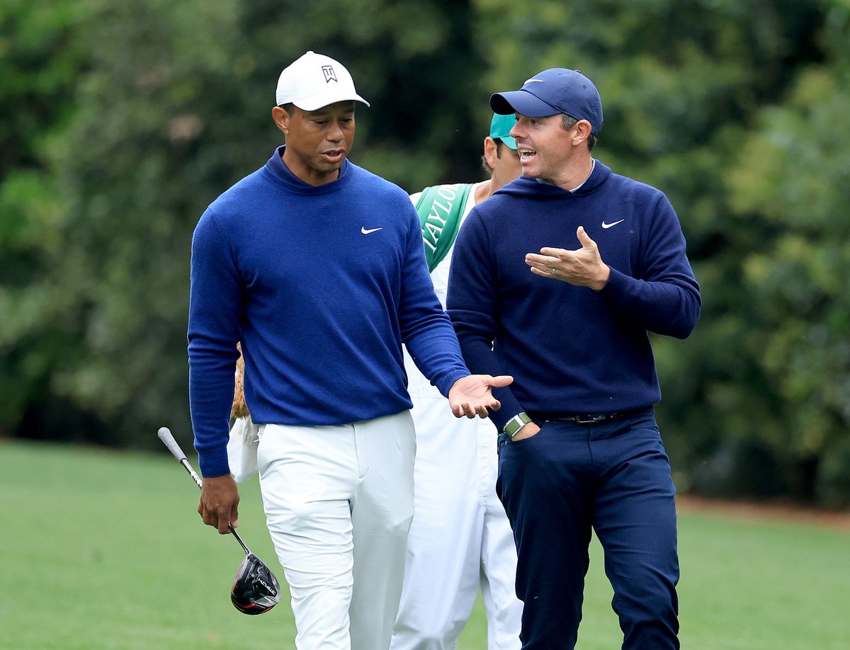 Tiger Woods speaks to Rory McIlroy