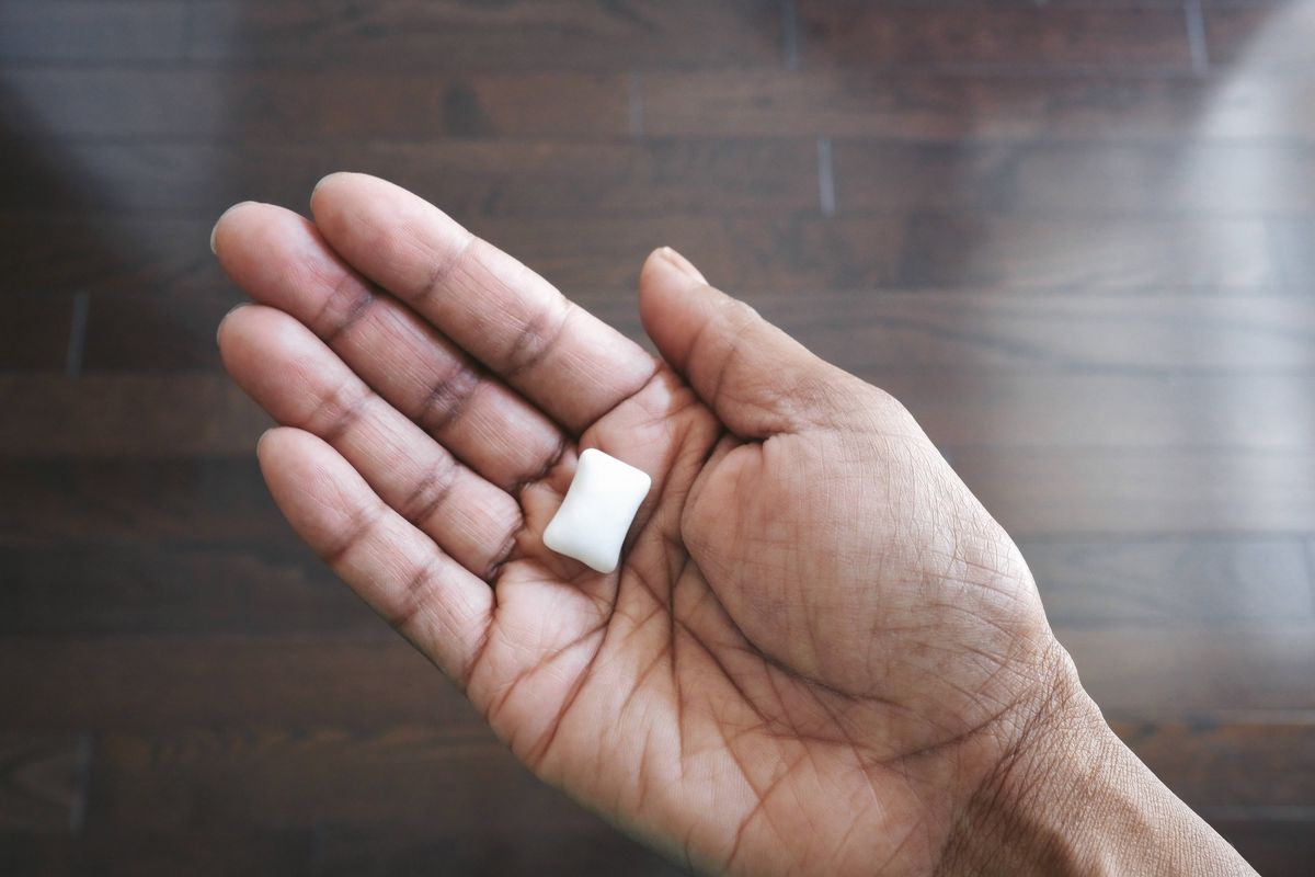 Hand holding chewing gum