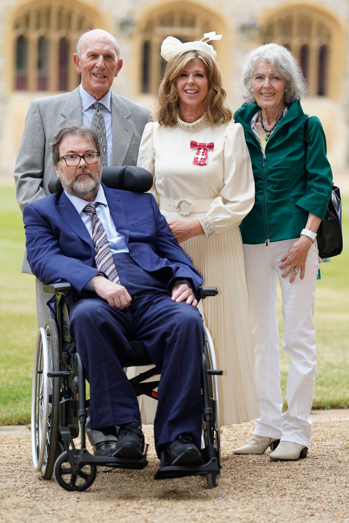 kate gets mbe with family and derek by side