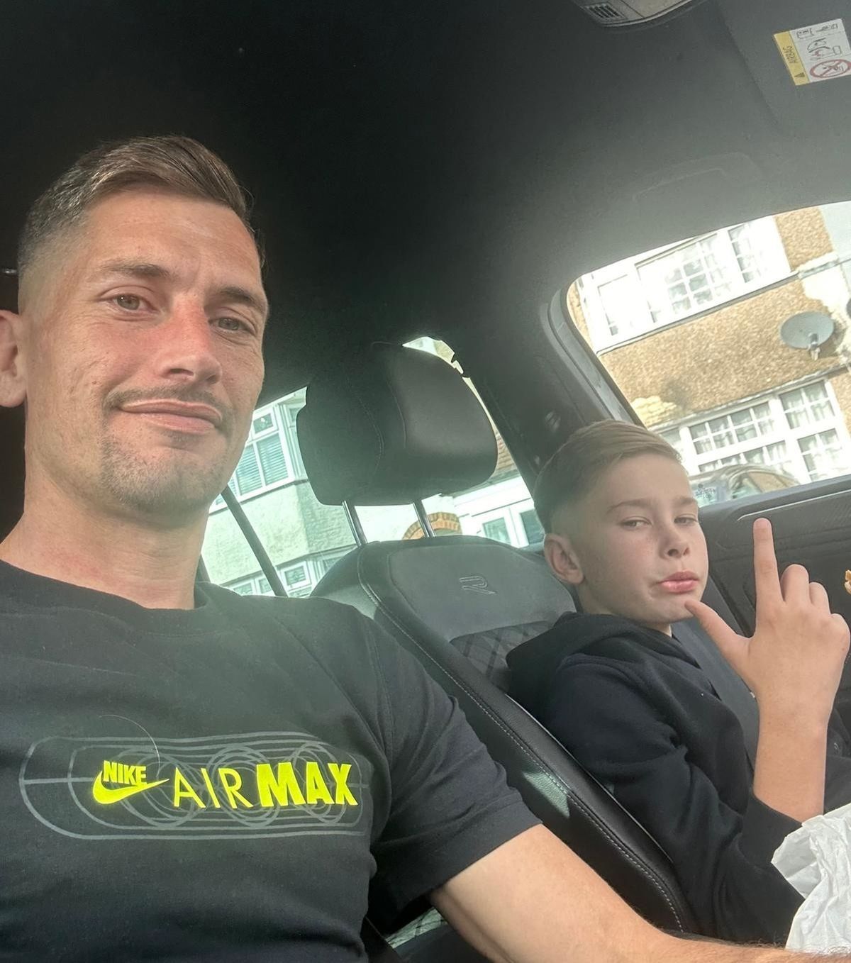 James Lewis and his dad in a car