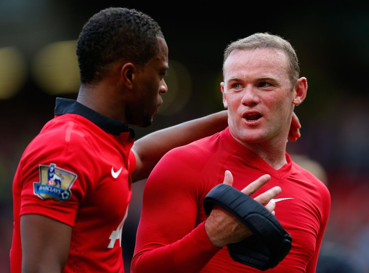 Patrice Evra talks with Wayne Rooney
