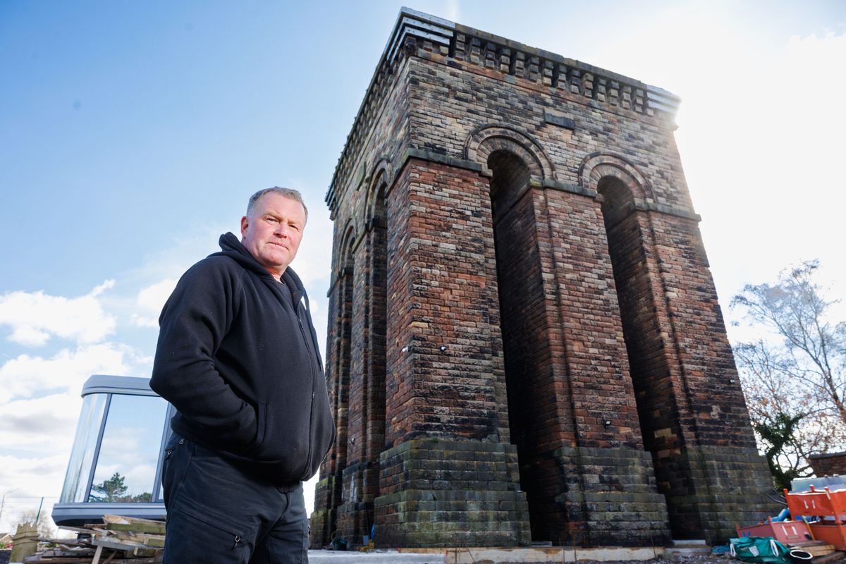 Neil Dawson, who is in the process of erecting a house for his family on top of Tower Hill Water Tower in Ormskirk.