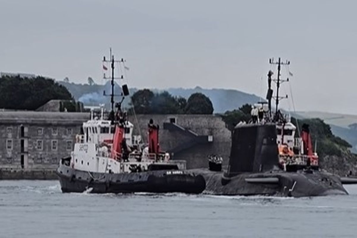 Astute Class nuclear-powered submarine crossing Plymouth Sound on morning of June 30, escorted by police and shepherded by Serco tugs