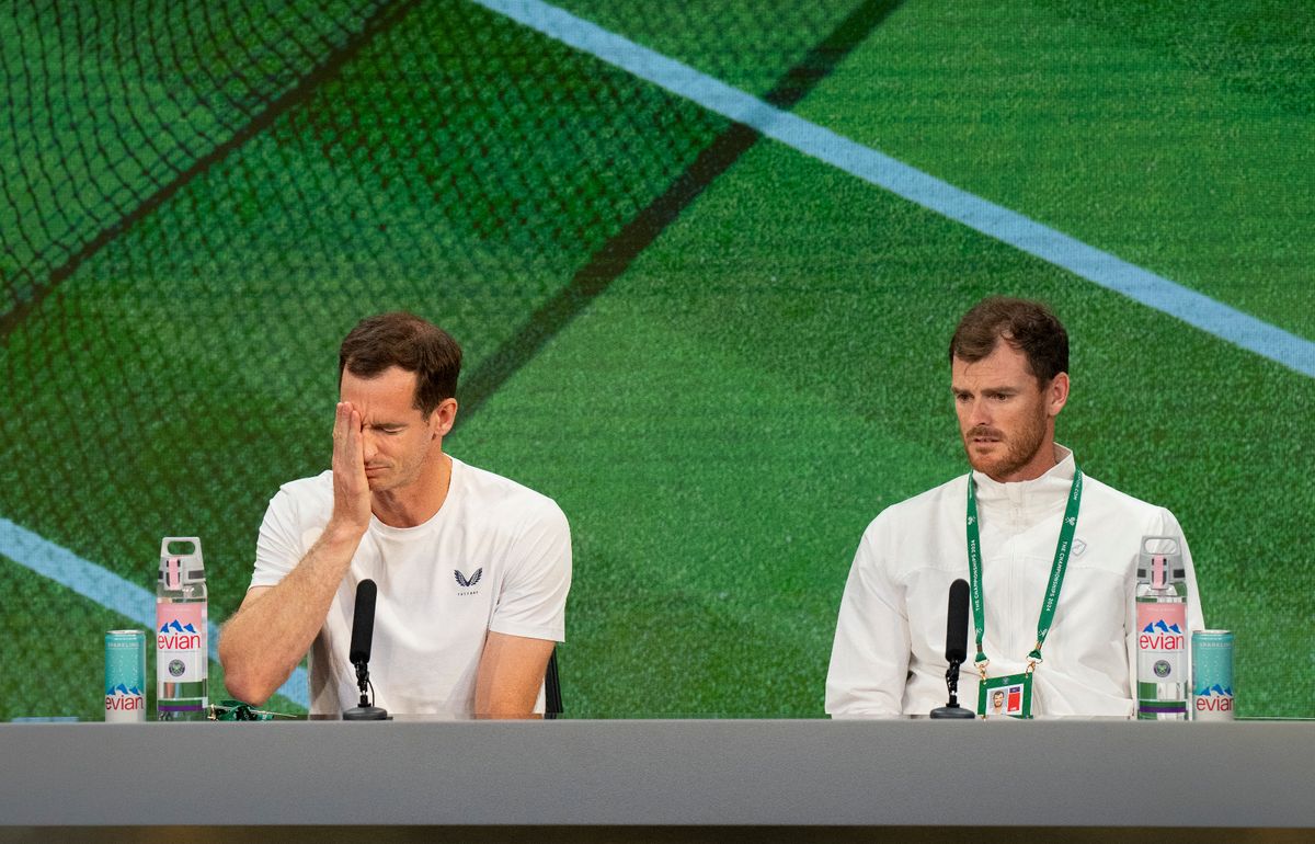 Britain's Andy Murray (L) and his brother Jamie, attend a Press Conference in the Media Theatre in the Broadcast Centre, after losing their men's first round doubles tennis match, on the fourth day of the 2024 Wimbledon Championships