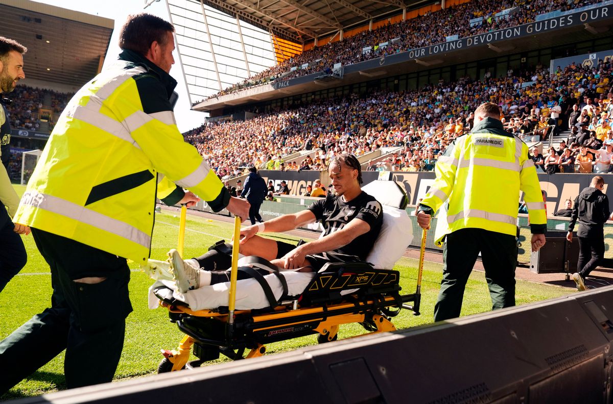 Xavi Simons is wheeled on a stretcher