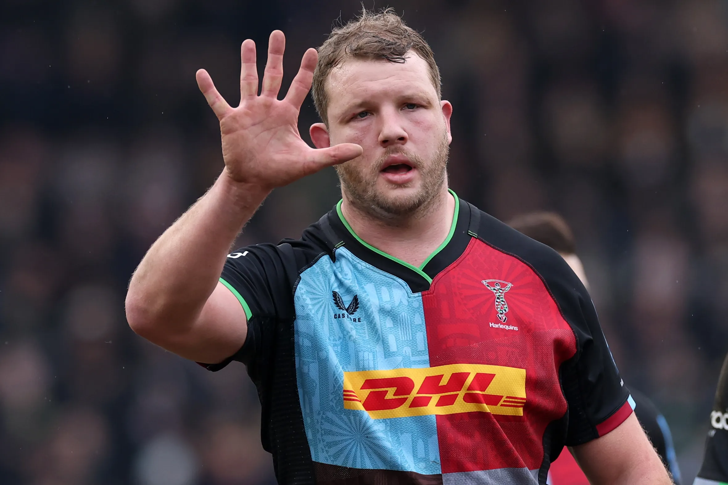 Joe Launchbury of Harlequins holding up his hand during a rugby match.