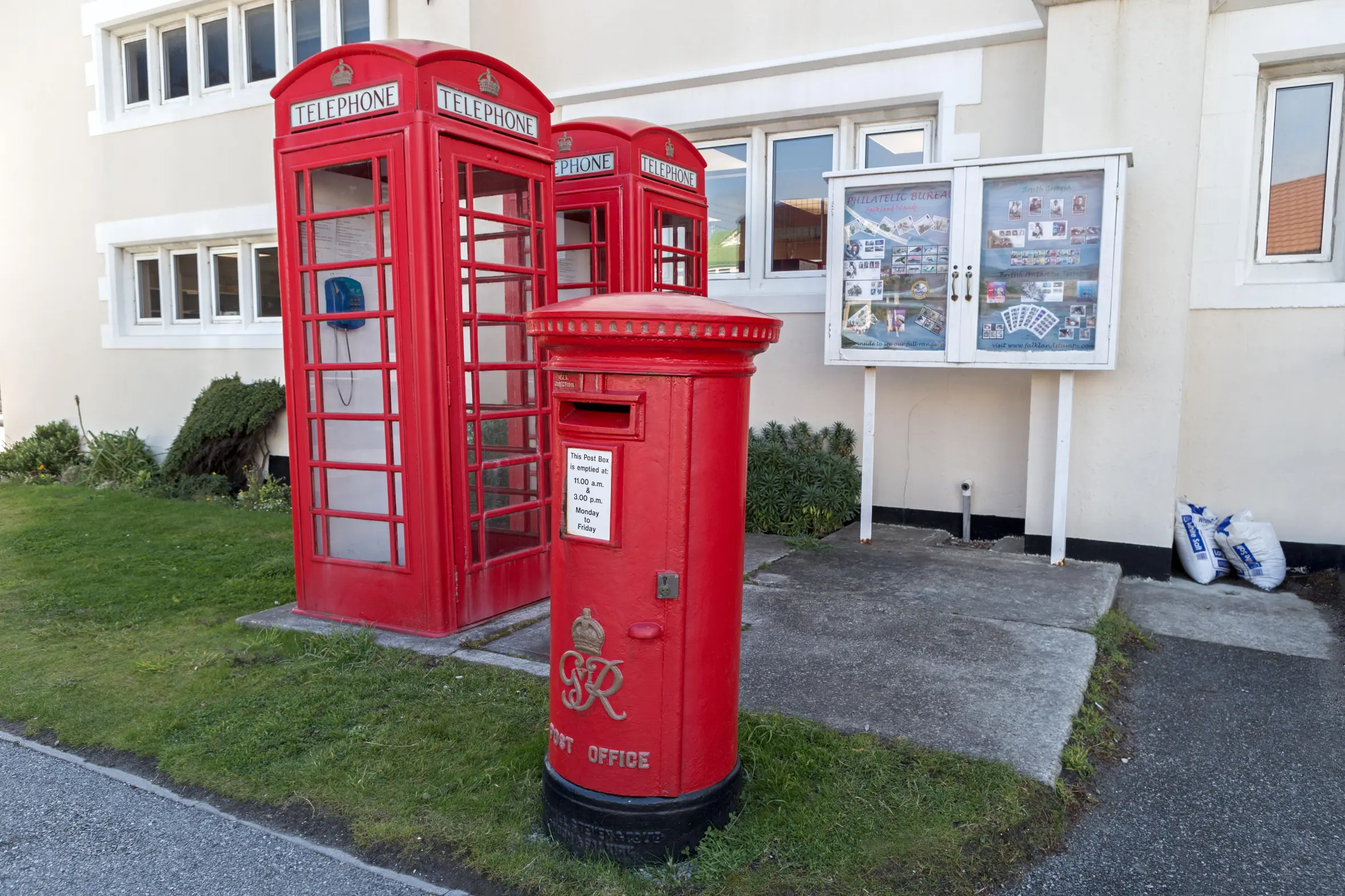 Red post office box and telephone booths in Stanley, Falkland Islands.