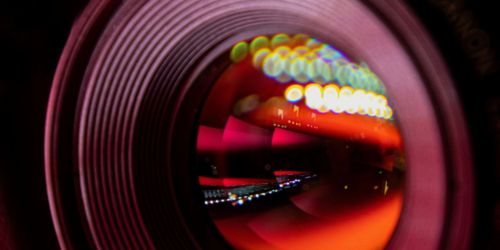 200MP iPhone camera rumors align on 2028 release | Stock photo shows a close-up of a camera lens