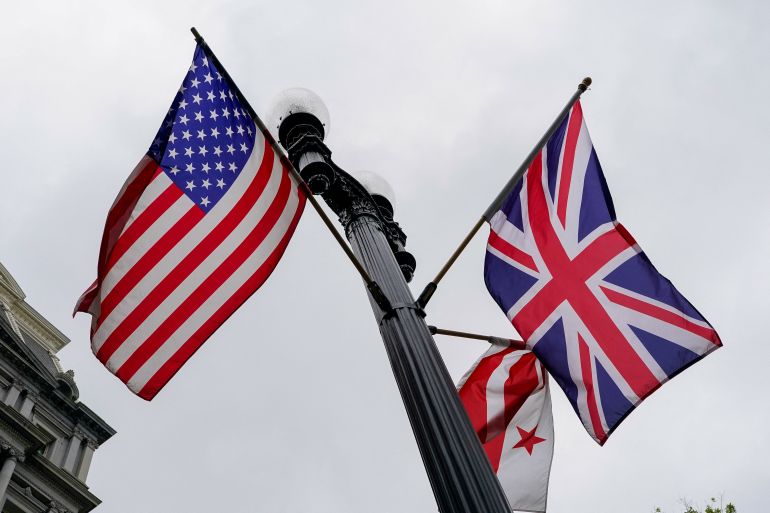 U.S., Union Jack, and Washington, D.C., flags fly in the wind near the White House ahead of Britain’s King Charles and Queen Camilla’s visit to the United States