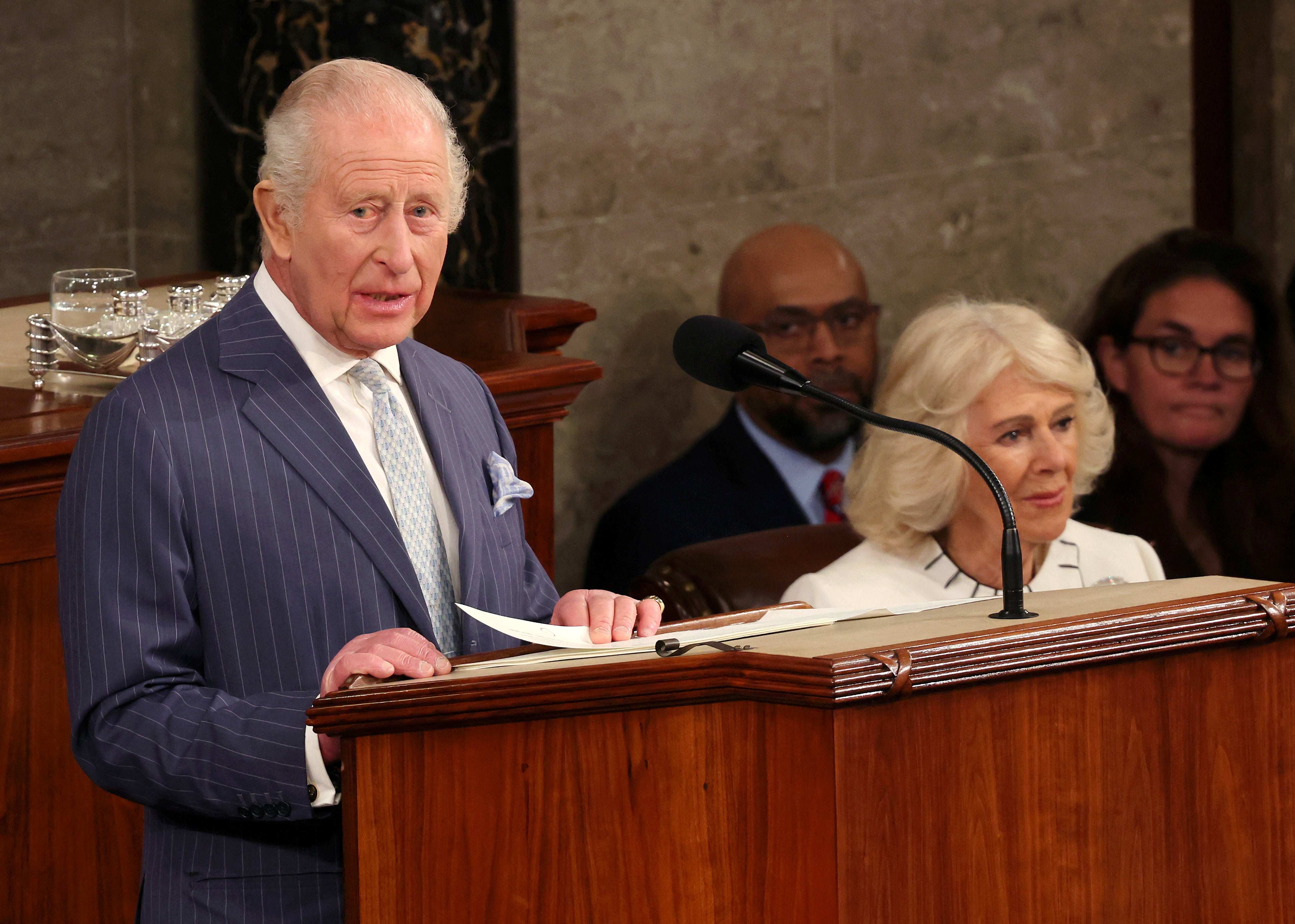 Queen Camilla sits beside King Charles III as he addresses both chambers of Congress Tuesday afternoon