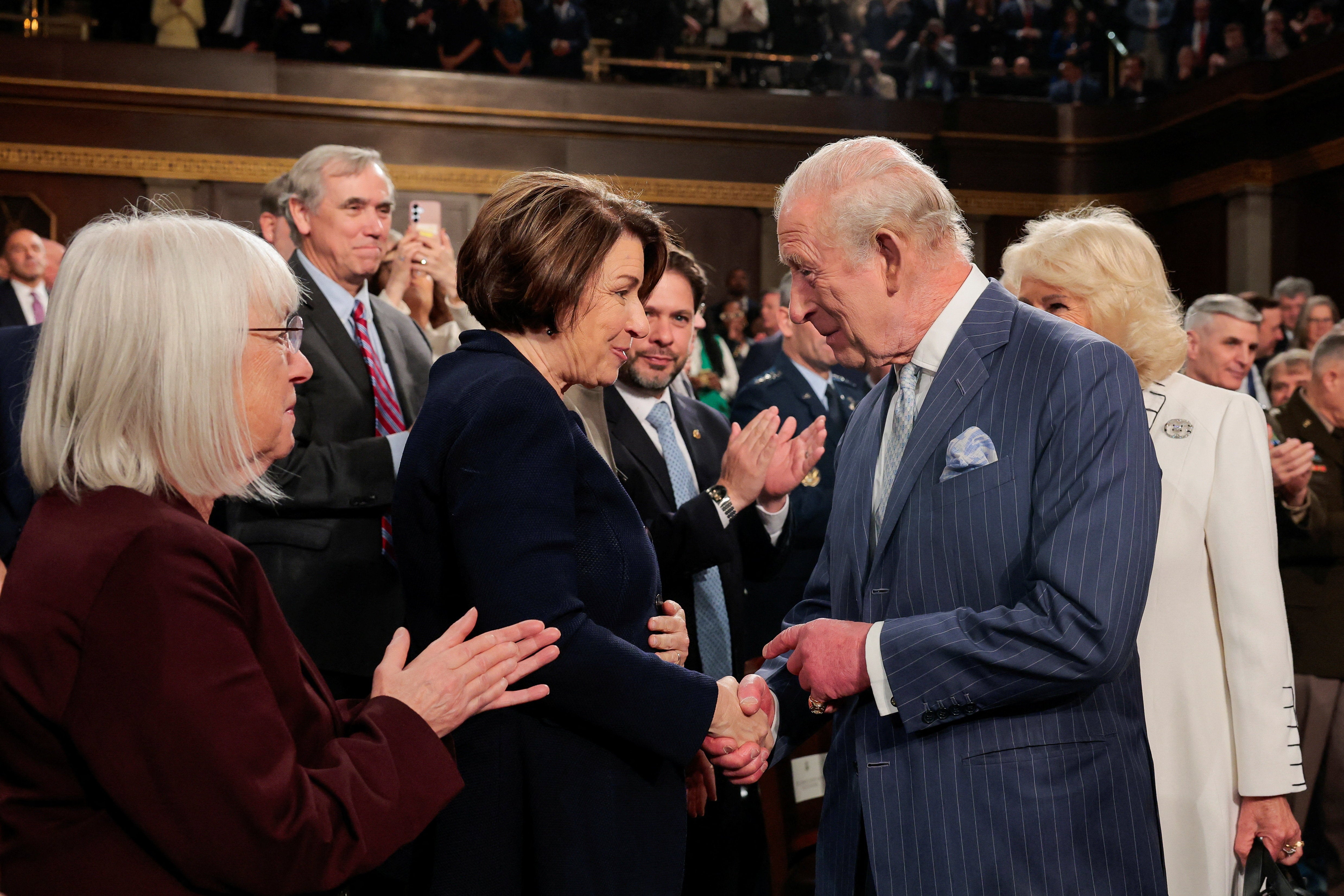 King Charles shakes the hand of U.S. Senator Amy Klobuchar
