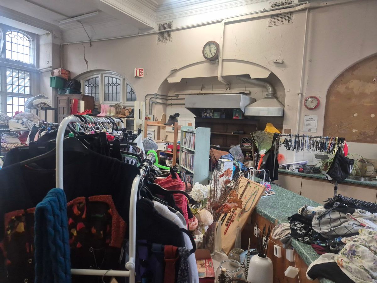 Inside Jayne's charity shop, remnants of the old cafe kitchen still visible