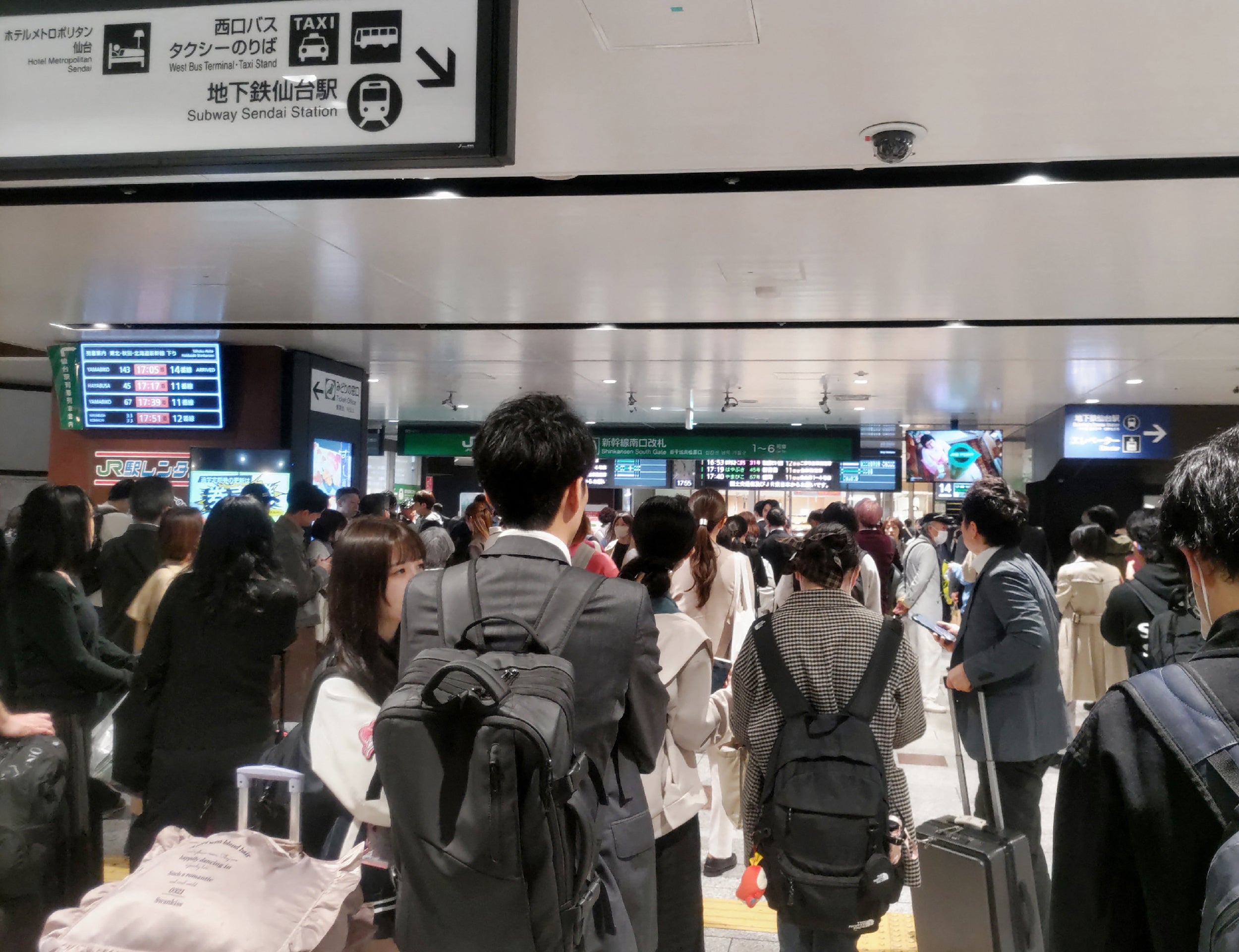 This photo shows a general view of a crowded railway station as the Shinkansen services are suspended after an earthquake hit northern Japan, in Sendai city of Miyagi prefecture