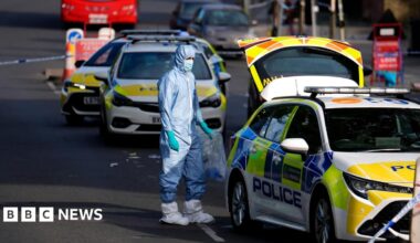Police in forensic body suit at scene of stabbing in Golders Green