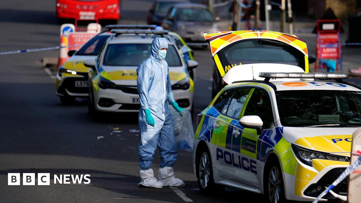 Police in forensic body suit at scene of stabbing in Golders Green
