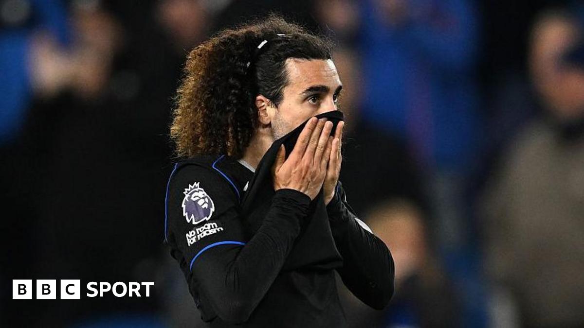 Marc Cucurella pulls his shirt up over his mouth after defeat at Brighton
