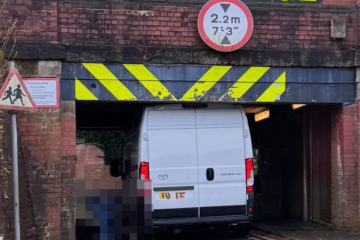 The white transit appeared to have become stuck under the low bridge, at the junction with Highfield Road and Heathbank Road in Cheadle Hulme