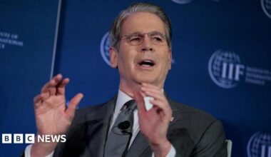 Workers unload goods from the back of a truck at the Jamila food market in Sadr City, east Baghdad on April 13, 2026.