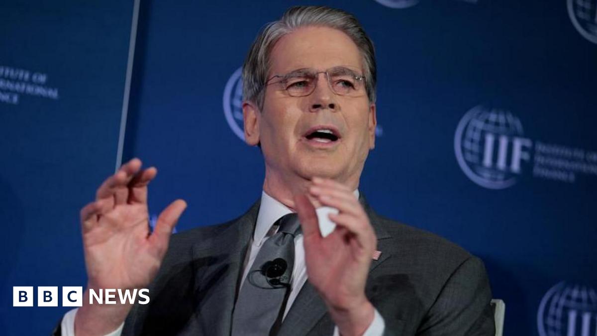 Workers unload goods from the back of a truck at the Jamila food market in Sadr City, east Baghdad on April 13, 2026.