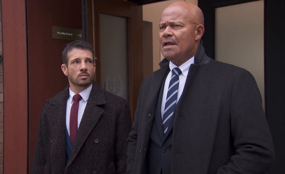 hollyoaks dodger savage and donny clark in suits and jackets outside the court building