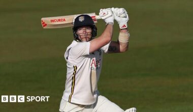 Right-hander Matthew Potts with the bat above his head as he plays a shot through the offside in evening sunshine in Durham