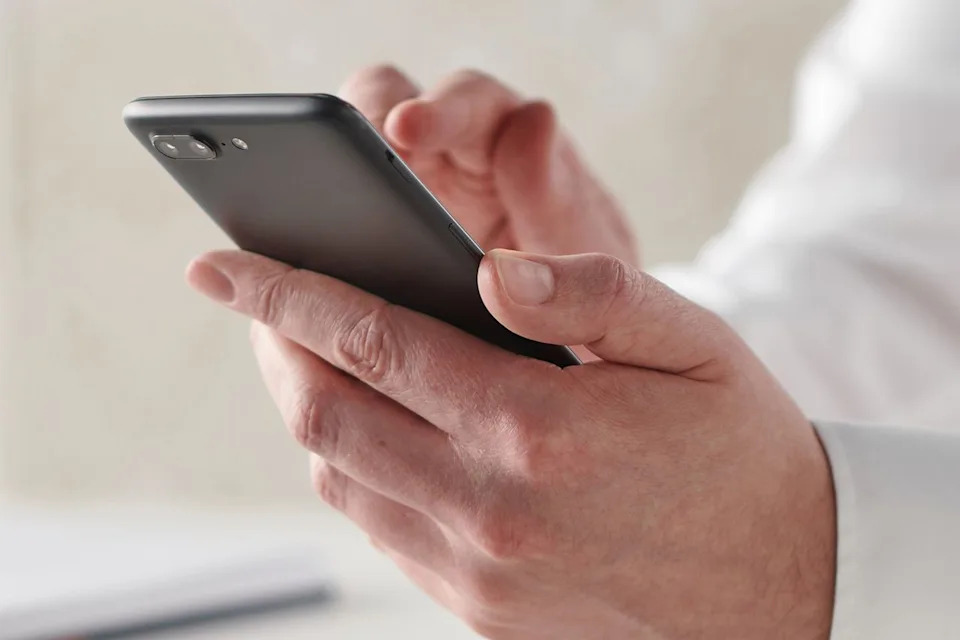 Stock image of a person using a smartphoneCredit: Neil Godwin/Future via Getty