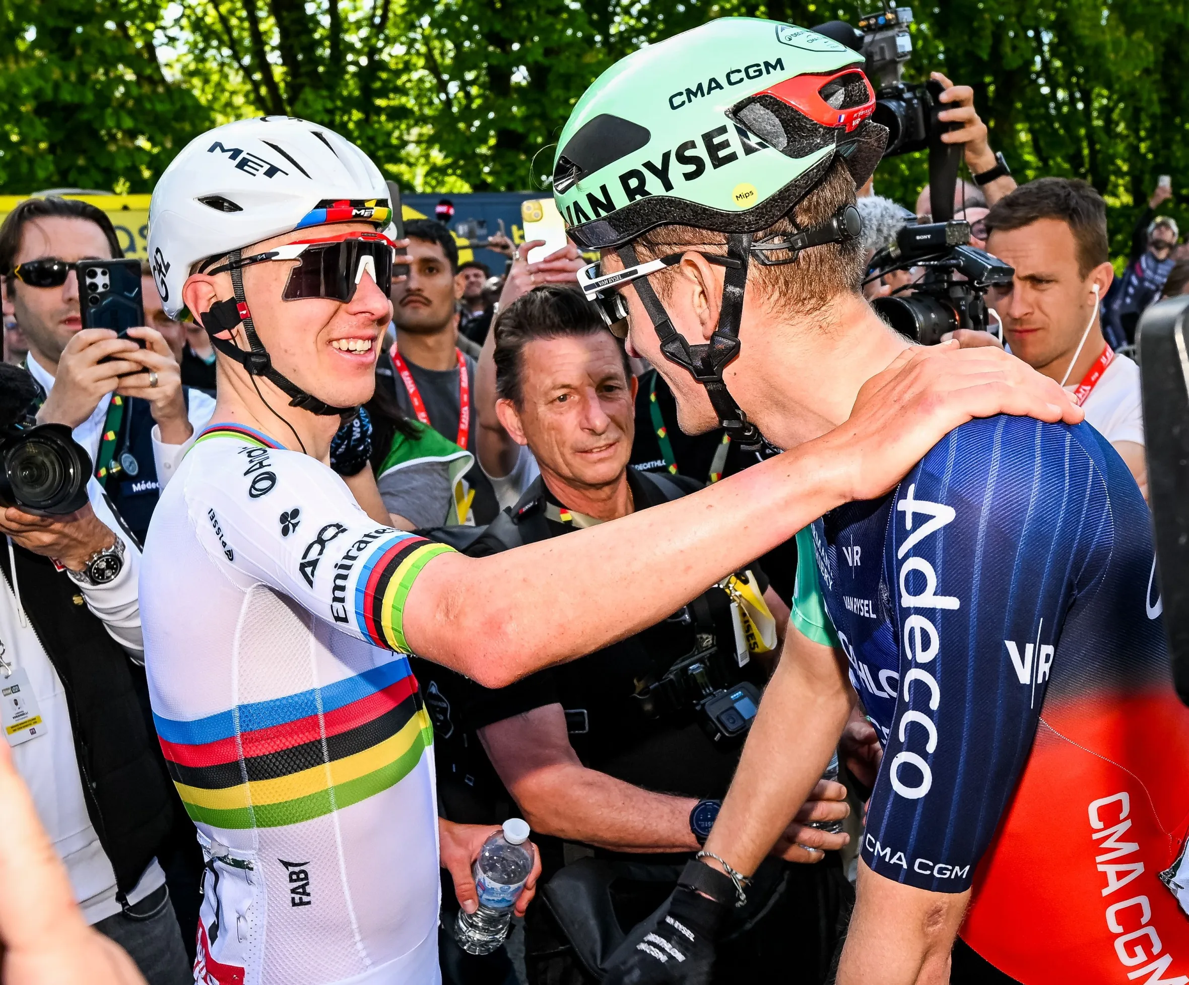 Tadej Pogacar and Paul Seixas celebrate after winning the men's elite race of the Liege-Bastogne-Liege cycling race.