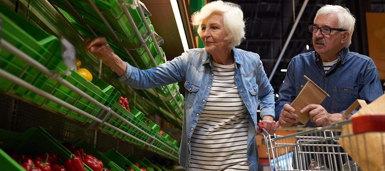 Senior couple shopping for groceries