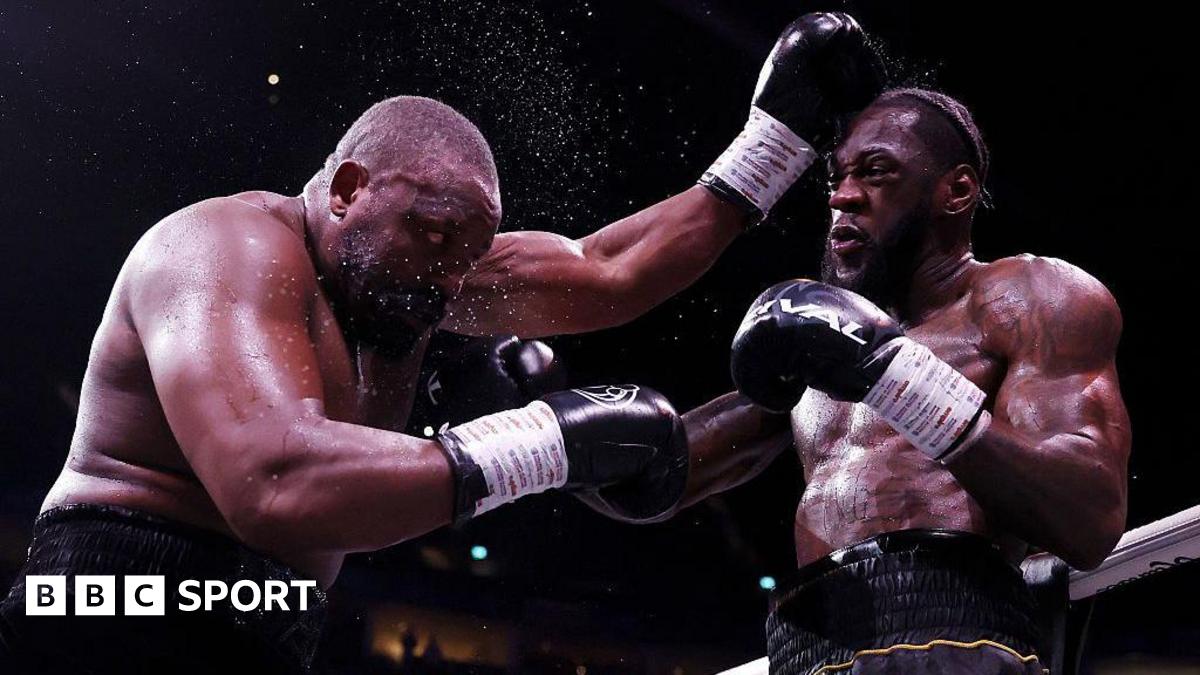 Derek Chisora is punched by Deontay Wilder