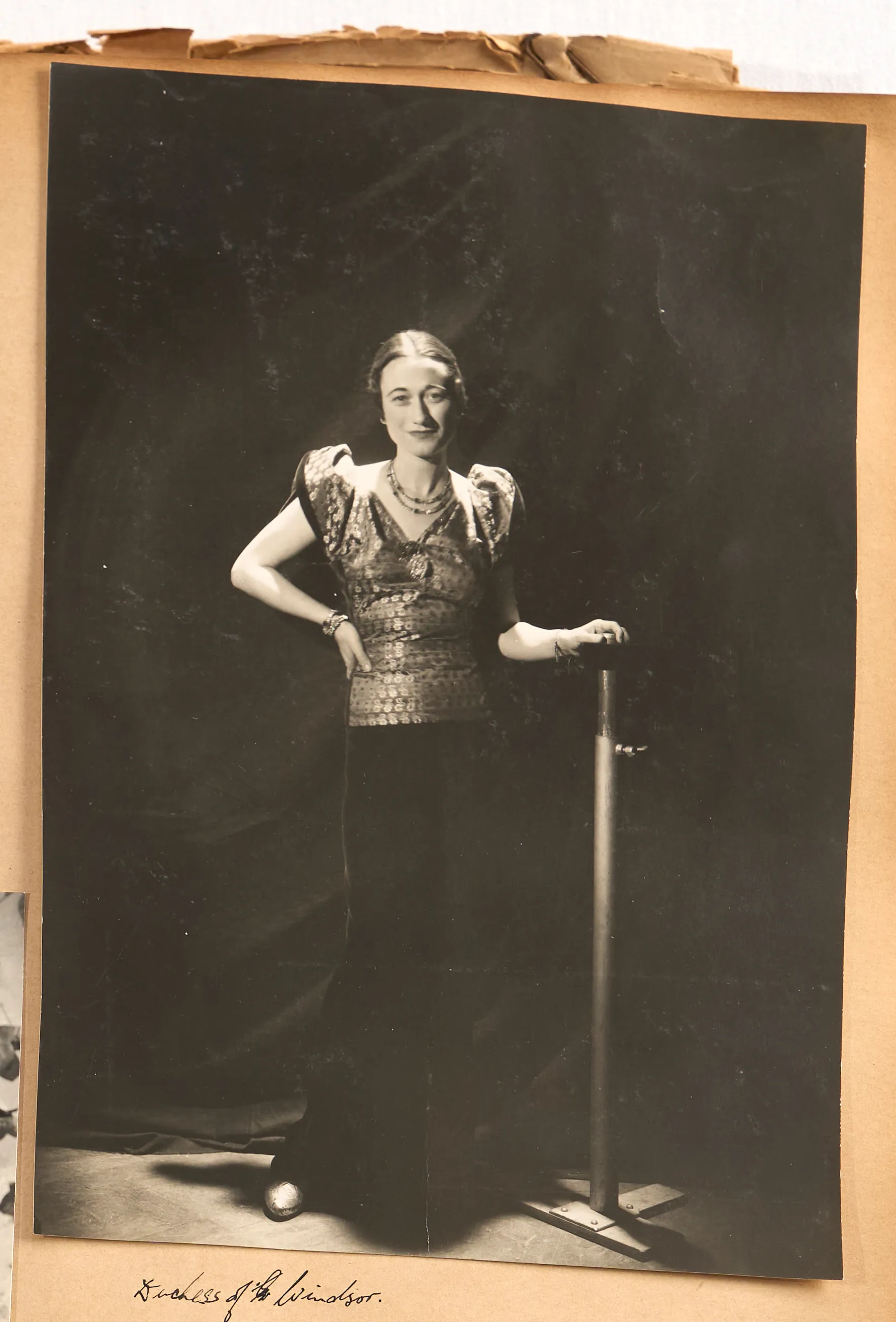 Collage of black and white photos from the Miller-Beaton scrapbook, showing several individuals including Diana Winyard, Adel the Aire, and the Duchess of Windsor.