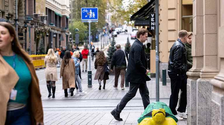 People dressed for autumn walking in central Helsinki.