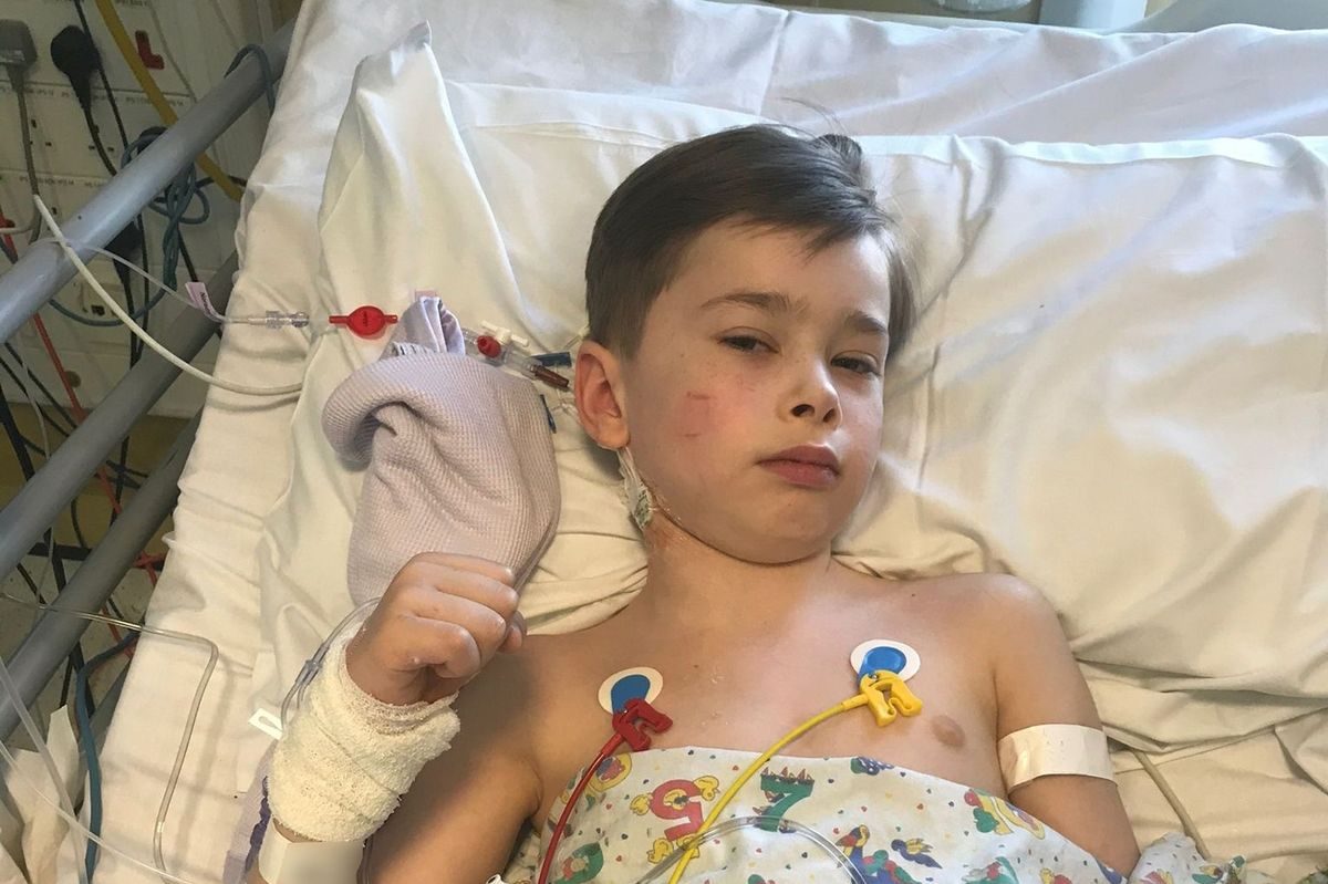 James Lewis in hospital bed