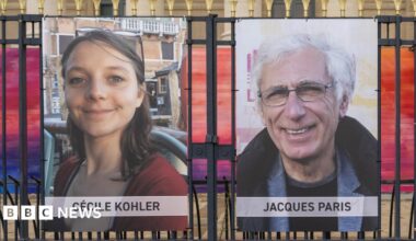 Pictures of Cecile Kohler and Jacques Paris are tied to railings.