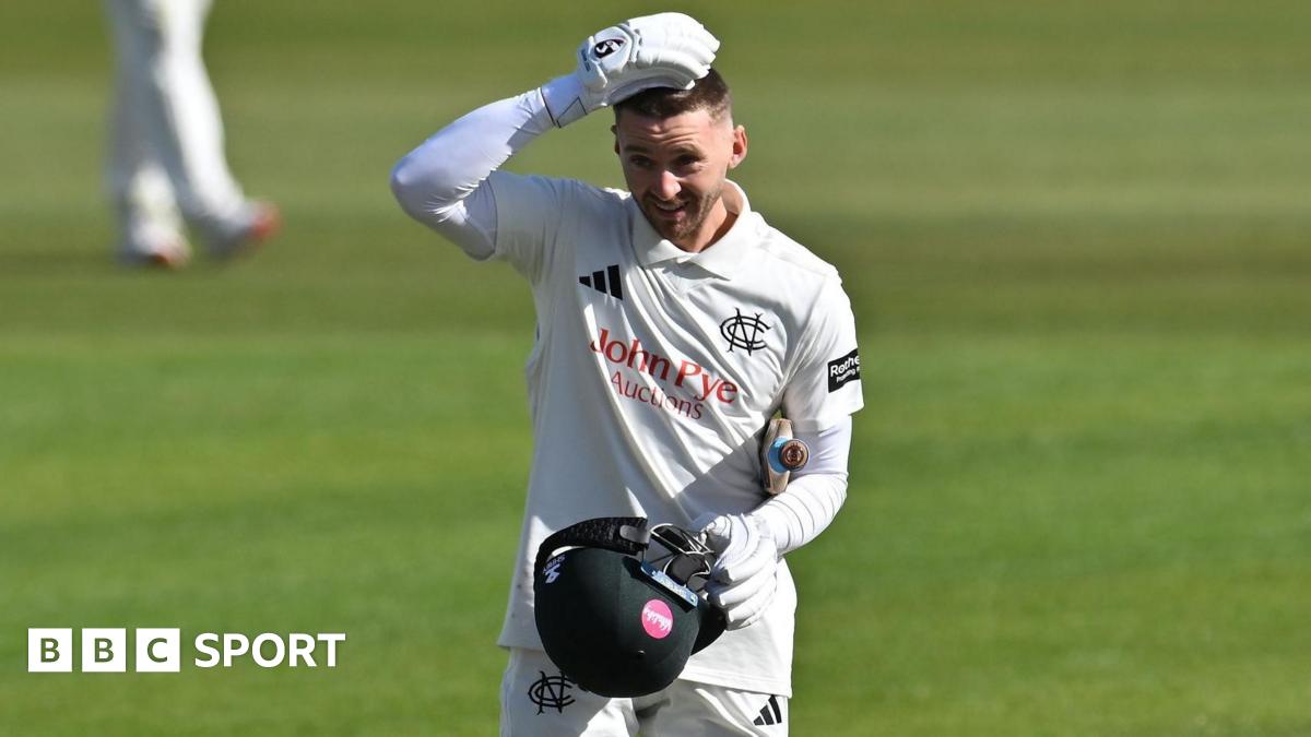 Joe Clarke celebrates with his helmet off for Nottinghamshire after scoring a century against Glamorgan